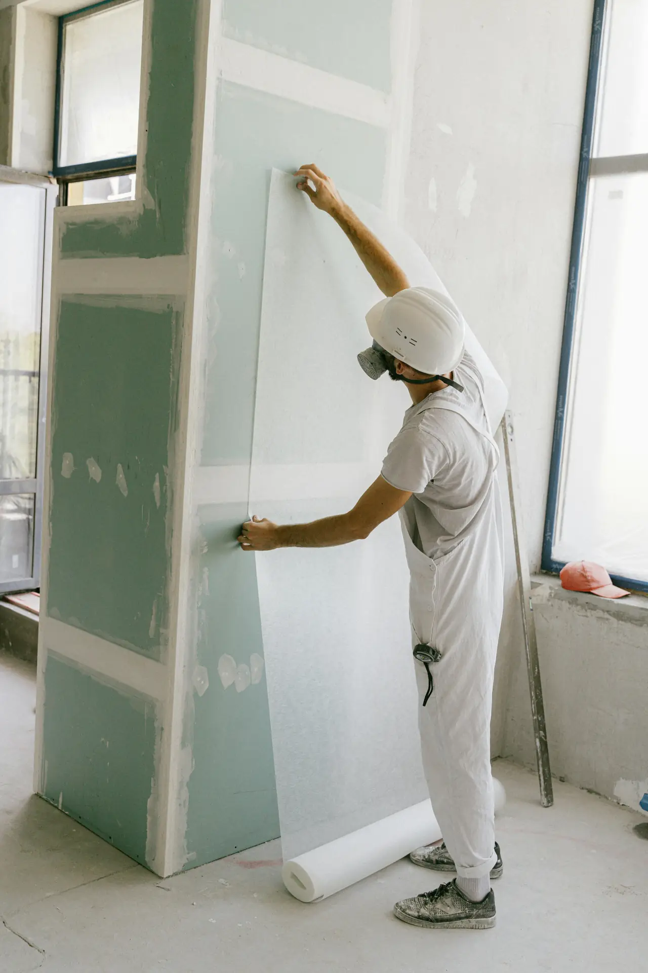 A painter finishing an interior wall